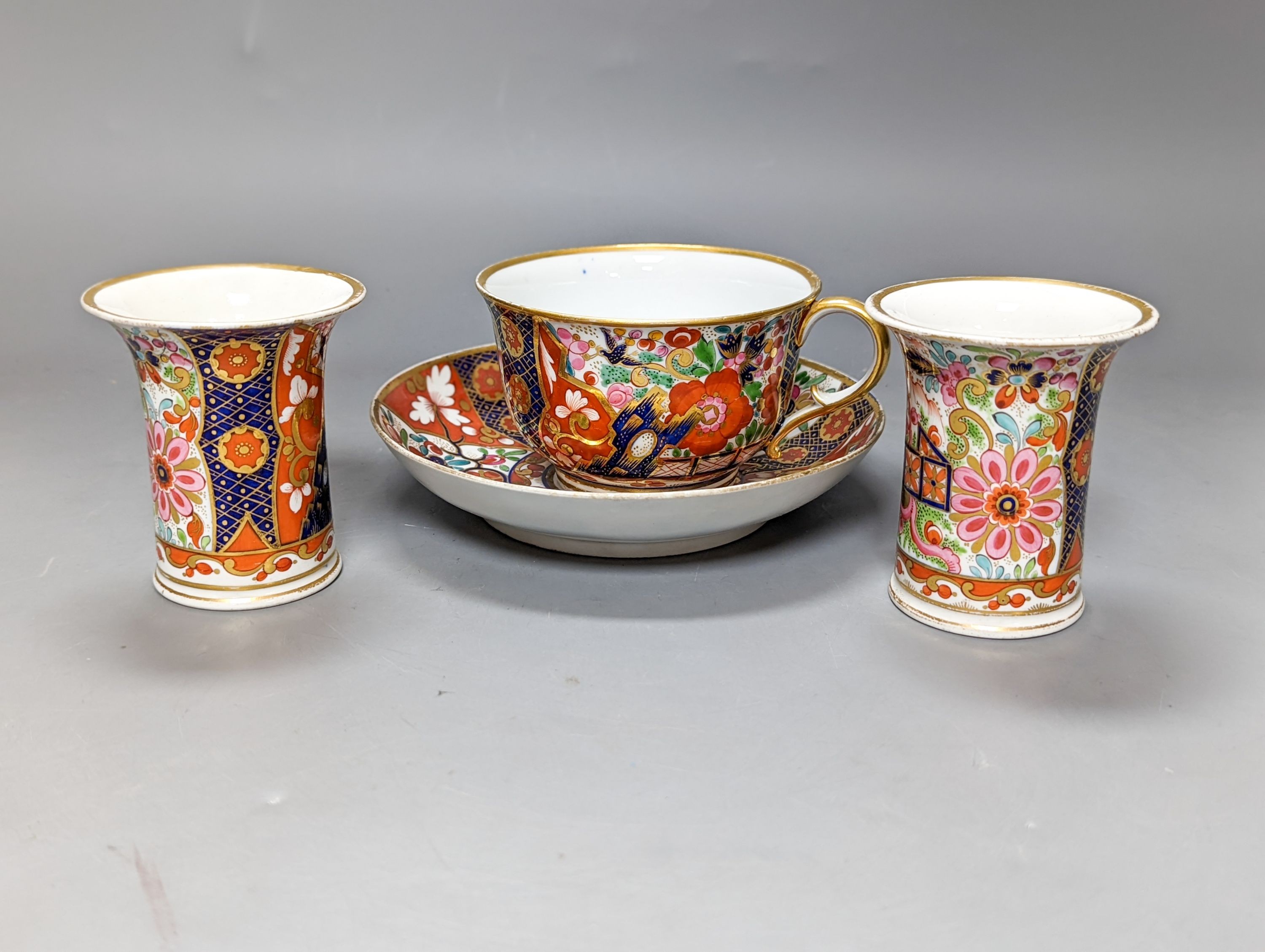 A pair of Chamberlain's Worcester miniature vases and Barr, Flight & Barr Worcester tea cup and saucer, early 19th century